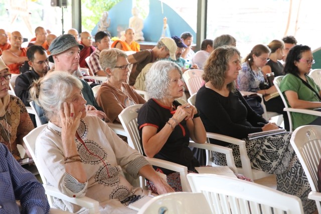 Participants of conference listen to Pomnyun Sunim