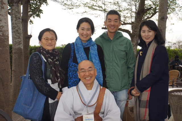 Sunim greeted by Buddhist group members from Tai Pei