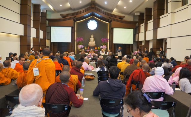 Sunim giving speech during conference