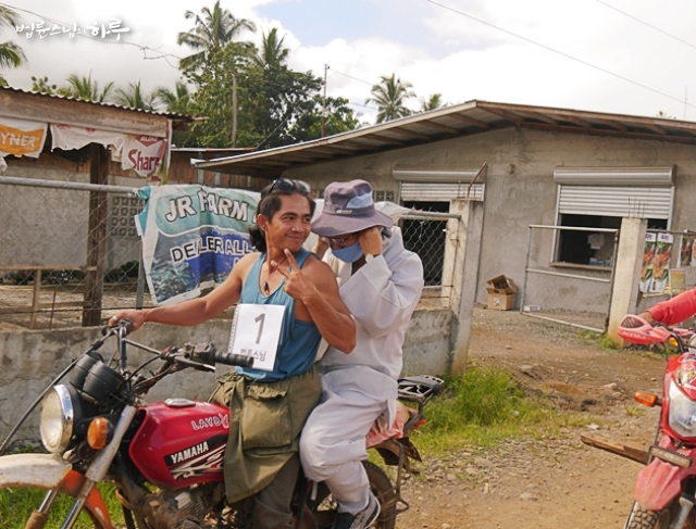 Pomnyun Sunim hops on a motorcycle